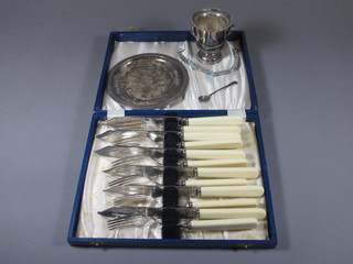 A circular white metal dish 5", a set of 6 silver plated fish knives  and forks, cased, a silver and marcasite brooch, a miniature  plated bucket and a silver mustard spoon