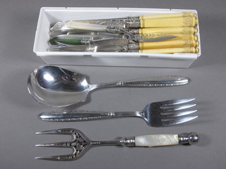 A set of 6 silver plated fish knives and forks, a silver plated  butter knife with mother of pearl handle, do. bread knife, 1 other  butter knife and a pair of salad servers