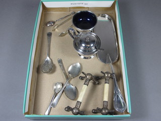 A silver plated crumb scoop, a mustard and salt, pair of knife rests and a small collection of flatware