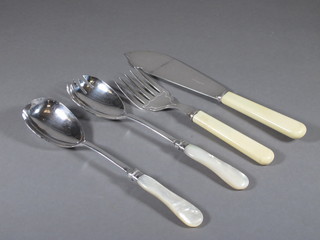 A pair of silver plated fish servers, a pair of silver plated salad servers with mother of pearl mounts