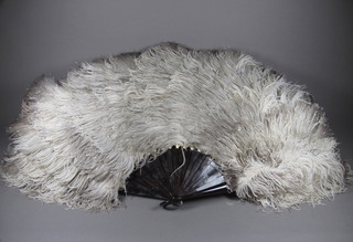 An ostrich feather fan by Duvelleroy contained in a silk case