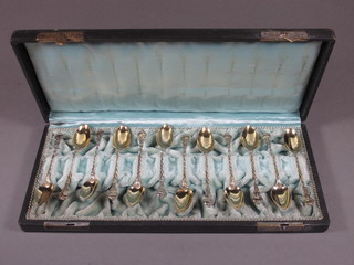 A set of 12 Continental gilt metal teaspoons, cased