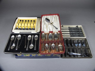 A set of 12 silver plated fruit spoons and forks and server, a set of 6 silver plated fish knives and forks, 4 silver plated teaspoon  tongs, 6 tea knives, 6 grapefruit spoons and server, 13 silver plated pastry forks, 6 chromium plated bean end coffee spoons, all case