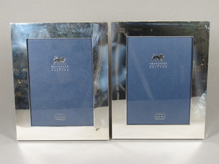 A pair of modern silver easel photograph frames 7" x 5"
