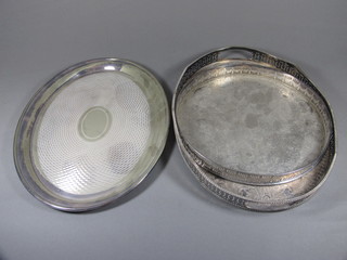 A circular silver plated galleried tea tray 11 1/2", an oval galleried tea tray 16" and a platter 16"
