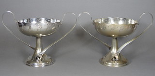 A pair of WMF pierced twin handled silver plated comports 14"  ILLUSTRATED