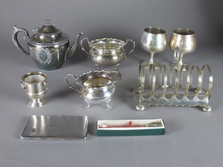 A Britannia metal teapot, a silver plated toast rack and a small collection of plated items