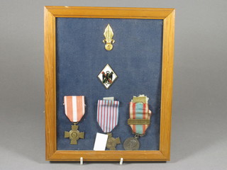 A French combat cross, 2 other French medals and 2 badges