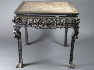 A square Oriental carved and pierced hardwood table inset a pink veined marble top 32"w x 32"d x 31"h