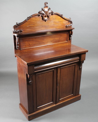 A Victorian mahogany chiffonier with raised back fitted shelves, the base with drawer above a double cupboard raised on a  platform base 35"w x 14 1/2"d x 56"h