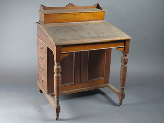 A Victorian walnut Davenport with stationery box to the top, the  pedestal fitted 5 long drawers 29"w x 26"d x 38"h