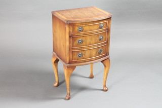 A Georgian style yew bow front cabinet fitted 1 long drawer  above a cupboard enclosed by a panelled door and raised on  cabriole supports 15"w x 12"d x 26"h