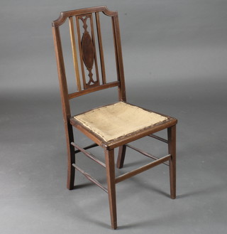 An Edwardian inlaid mahogany bedroom chair raised on square tapering supports, requires upholstery,