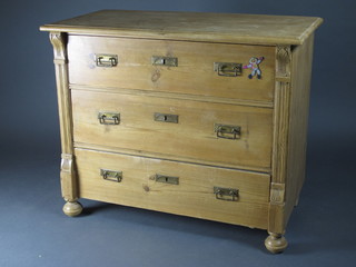 A Continental polished pine chest of 3 long drawers, raised on  bun feet 40"w x 20"d x 33"h