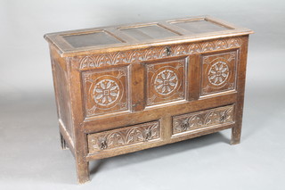 An 18th Century oak mule chest with hinged lid, the interior  fitted a candle box, the base fitted 2 drawers, 44"w x 20"d x  30"h