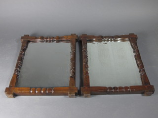 A pair of Victorian rectangular plate mirrors contained in a carved hardwood Cambridge style frames decorated figures 27" x  21"
