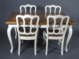 A French oak and white painted dining suite comprising  rectangular parquetry style drawleaf dining table raised on cabriole supports 56"w x 35"d x 30 1/2"h together with a set of 6  tulip back dining chairs with woven cane seats raised on cabriole  supports