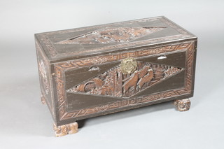 A carved Hong Kong camphor coffer with hinged lid, the interior fitted a tray, raised on carved supports 34"w x 17"d x 18 1/2"h