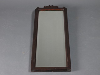 An Edwardian rectangular bevelled plate wall mirror contained in  a mahogany frame 30" x 11"