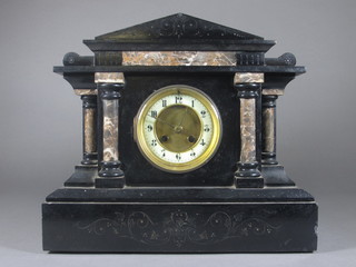 A Victorian French 8 day striking mantel clock with enamelled  dial and Arabic numerals contained in a marble architectural case