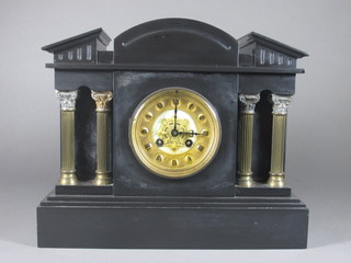 A Victorian 8 day striking mantel clock with gilt dial contained in  a black marble architectural case