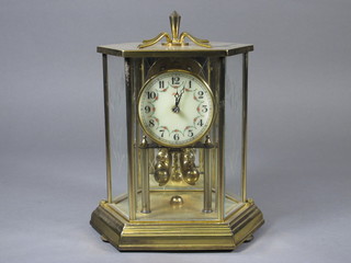 A German 400 day clock with enamelled dial and Arabic  numerals contained in a gilt lozenge shaped case