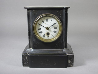 A Victorian French 8 day mantel clock with enamelled dial and Roman numerals contained in a black marble case