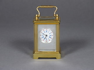 A reproduction miniature carriage clock 1"
