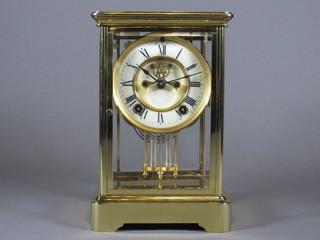 A 19th Century French striking 4 glass clock with enamelled  dial, Roman numerals, visible escapement and mercury pendulum   ILLUSTRATED
