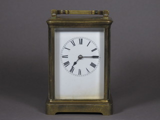 A 19th Century French carriage clock with enamelled dial and Roman  numerals contained in a gilt metal case