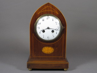 An Edwardian 8 day striking mantel clock with enamelled dial  and Arabic numerals contained in an inlaid mahogany lancet  shaped case