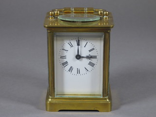 A 19th Century French enamelled mantel clock with enamelled dial and Roman numerals contained in a gilt metal case