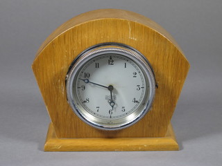 A Smiths 8 day car clock with silvered dial marked P333.450 contained in an oak case