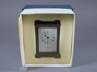 A 1985 Garrards carriage clock with enamelled dial contained in  a gilt metal case