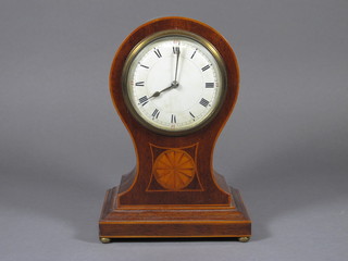 A bedroom timepiece with enamelled dial and Roman numerals  contained in an inlaid mahogany balloon shaped case