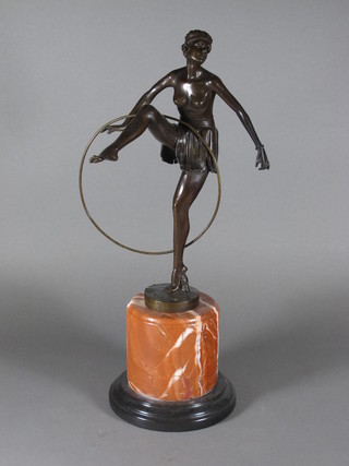 A bronze Art Deco style figure of a dancing girl with hoop,  raised on a marble base 19"