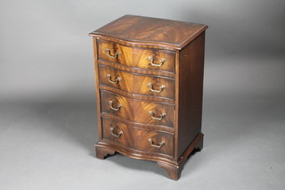 A Georgian style mahogany chest of serpentine outline with crossbanded top fitted 4 long drawers, raised on bracket feet  19"w x 14 1/2"d x 28"h
