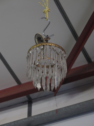 A circular glass 2 drop light fitting hung lozenges