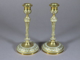 A pair of Empire style brass candlesticks 8"