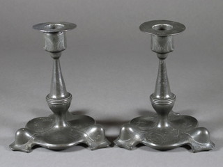 A pair of Orivit Art Nouveau pewter candlesticks, bases in the  form of a leaf 6"  ILLUSTRATED