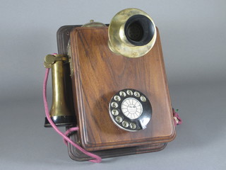 A reproduction wall mounting telephone