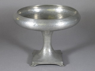 A circular Abby pewter planished bowl raised on a tapering foot  with square base, the base marked 1070 9 1/2"