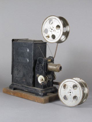 An early metal crank operated film projector