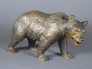 A carved wooden Swiss figure of a walking bear 10", foot f and  r,