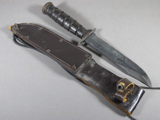 An American pilots knife by Camillus with 7" blade and leather scabbard