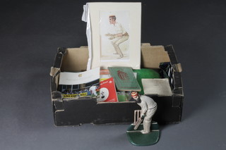 A cast iron door stop in the form of W G Grace, an album of  cricketing first day covers and a small collection of cricketing  cigarette cards etc