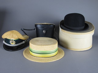 A gentleman's bowler hat by Lincoln & Bennett, a straw boater,  a grey top hat and a pair of binoculars