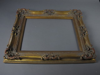 A gilt plaster and wood picture frame 20" x 16"