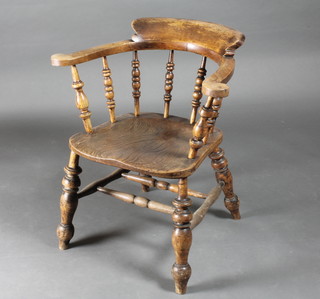 An elm stick and rail back captain's chair