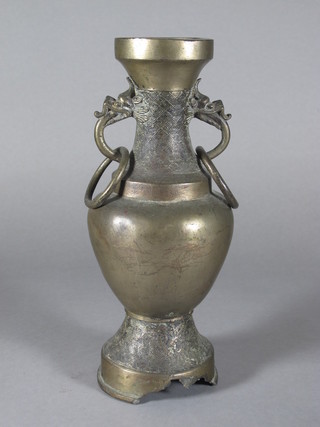 An Oriental bronze twin handled club shaped urn 11", crack to  base
